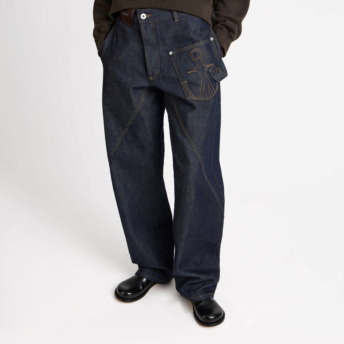 JW Anderson Indigo twisted-denim jeans | TheDoubleF
