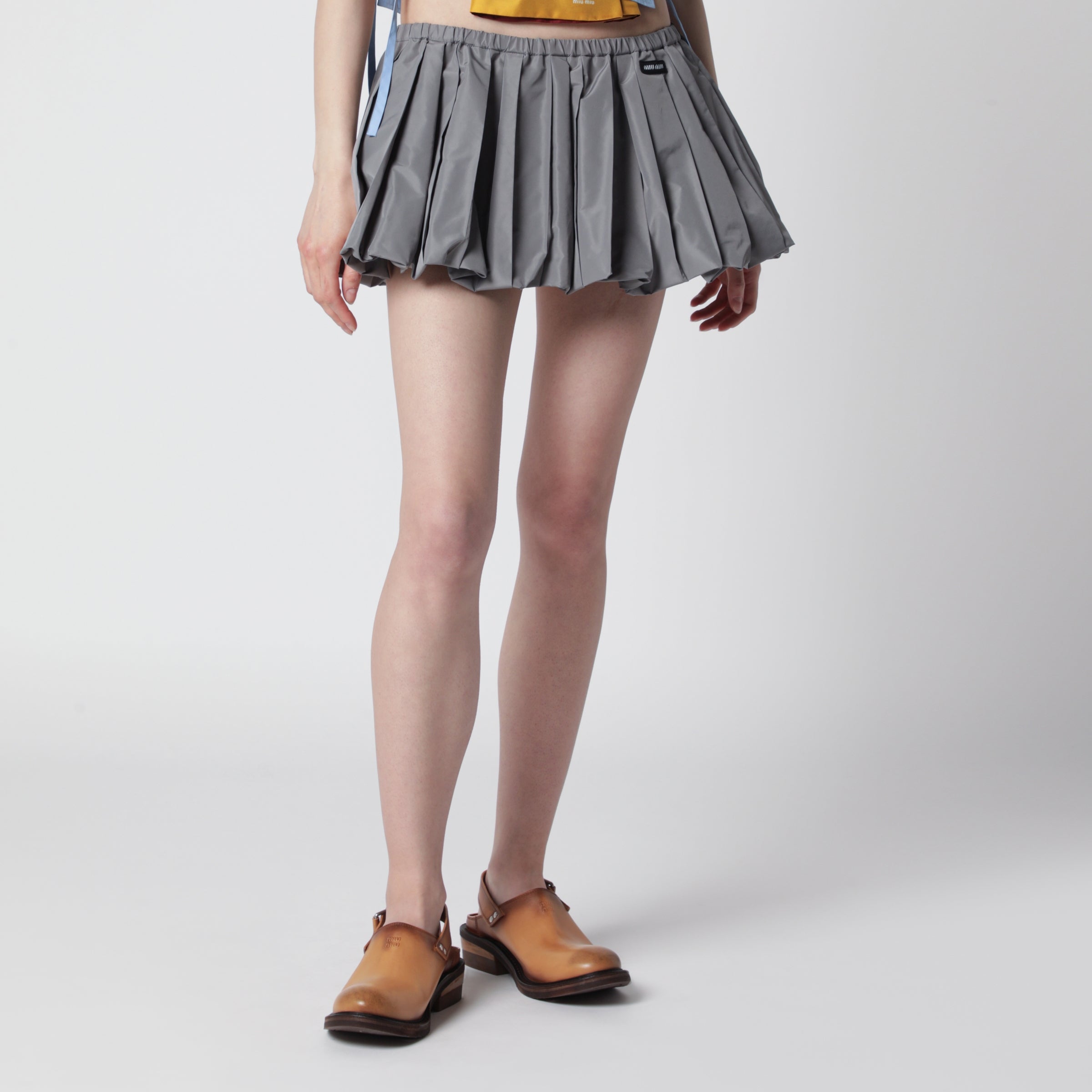 Miu Miu Pleated balloon Tec canvas miniskirt in lead grey | TheDoubleF