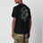T-shirt nera con stampa mimetica