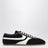 Schwarzer und weißer Sneaker aus Leder und Wildleder