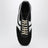 Sneakers noires et blanches en cuir et daim