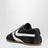 Sneakers noires et blanches en cuir et daim