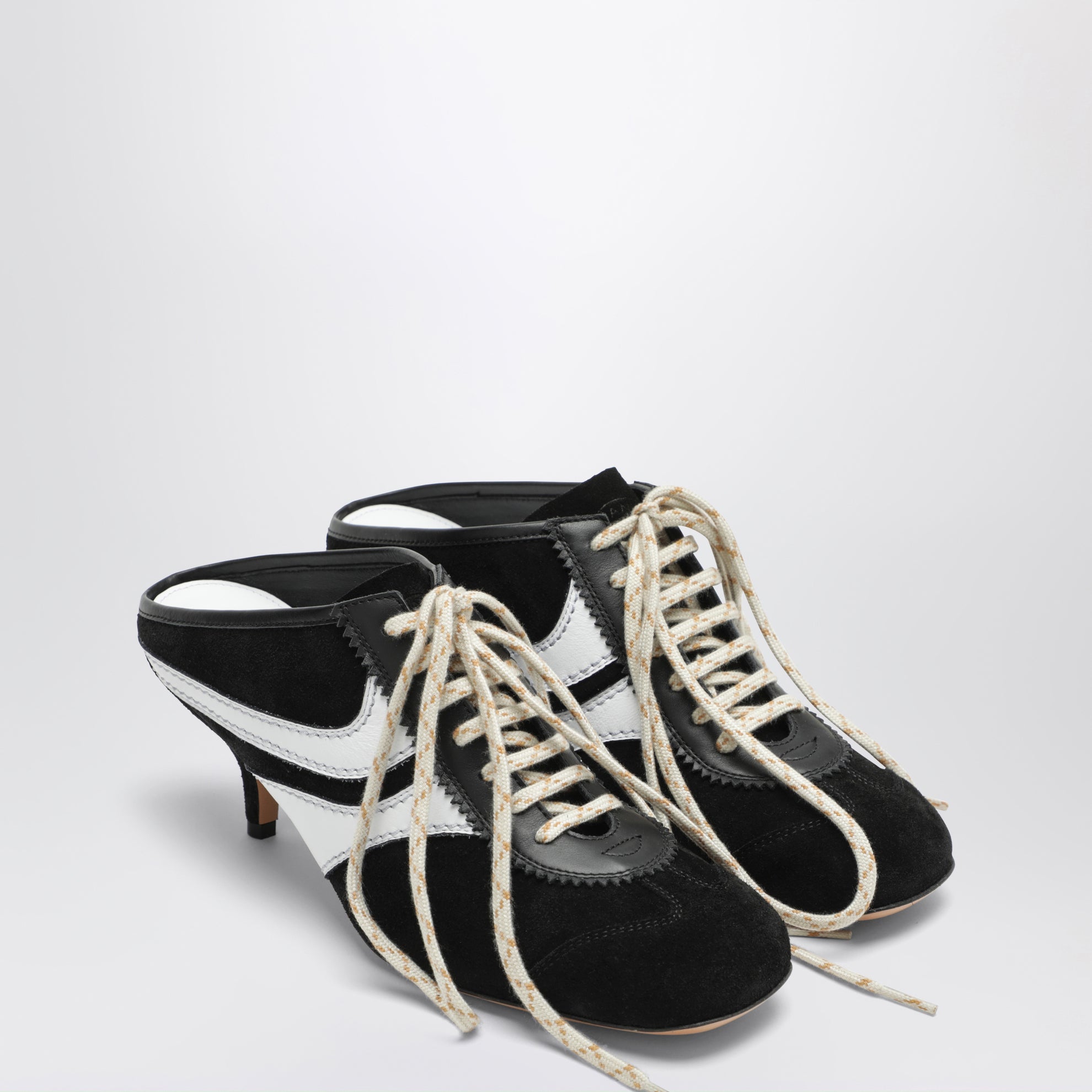 Mules 65 in suede e pelle neri e bianchi