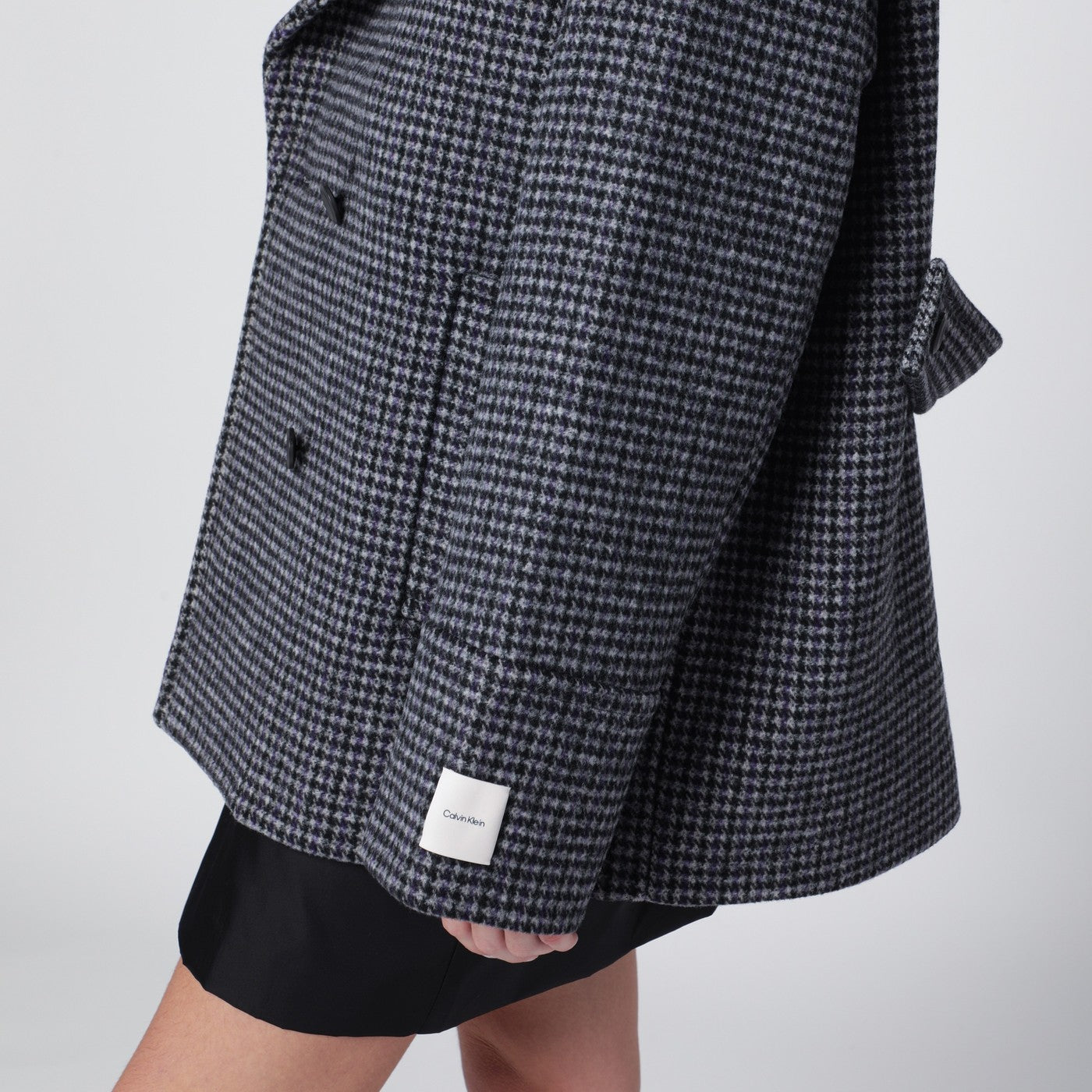 Grey double-breasted houndstooth coat