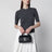 Dotta Baby black grained leather bag