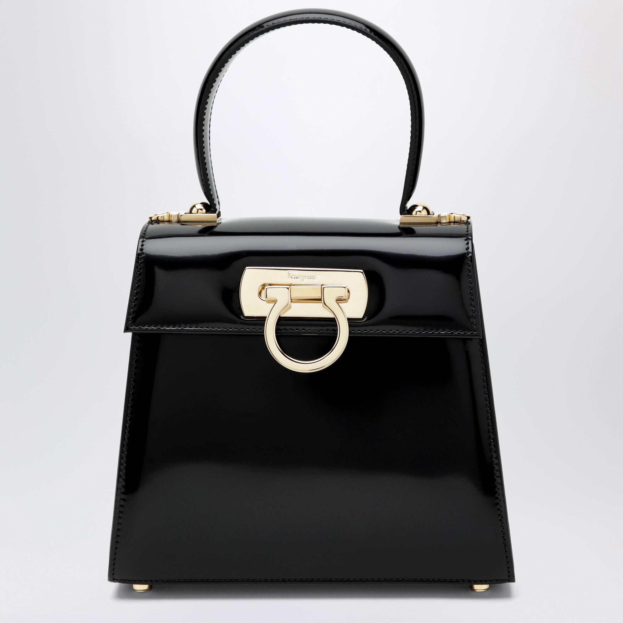 Small black leather top-handle bag with Gancini closure