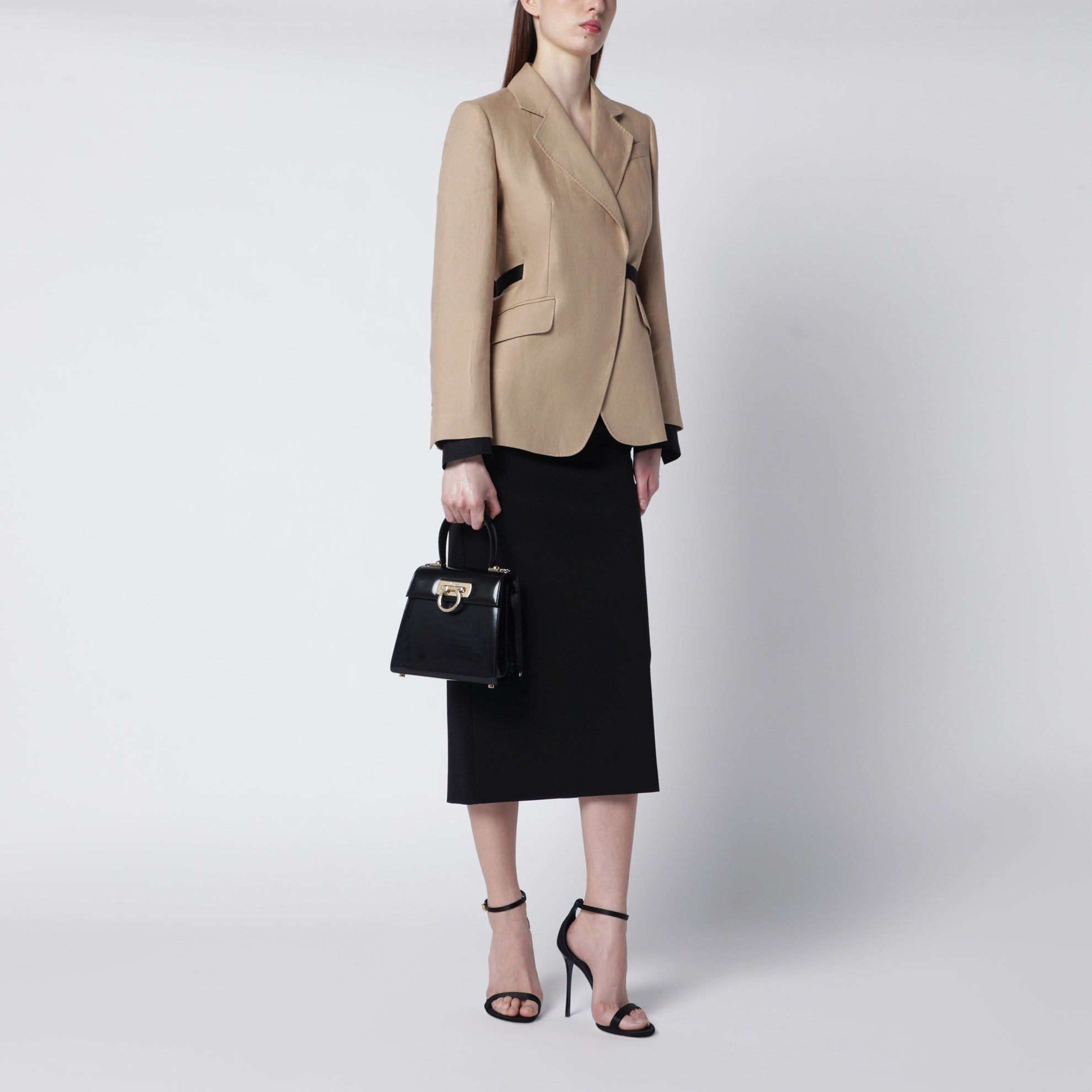 Small black leather top-handle bag with Gancini closure