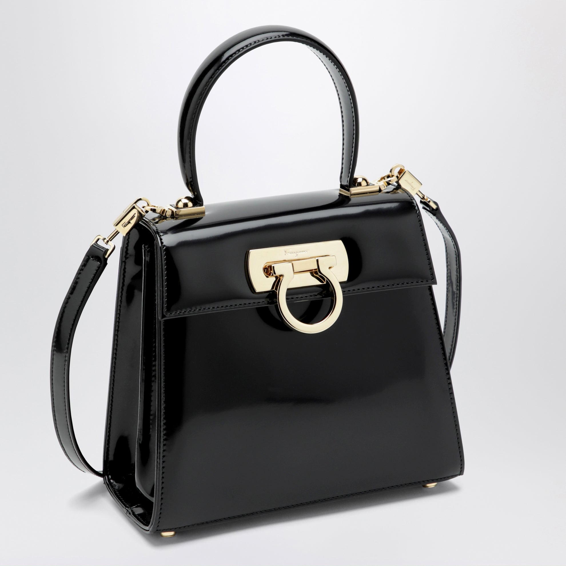Small black leather top-handle bag with Gancini closure