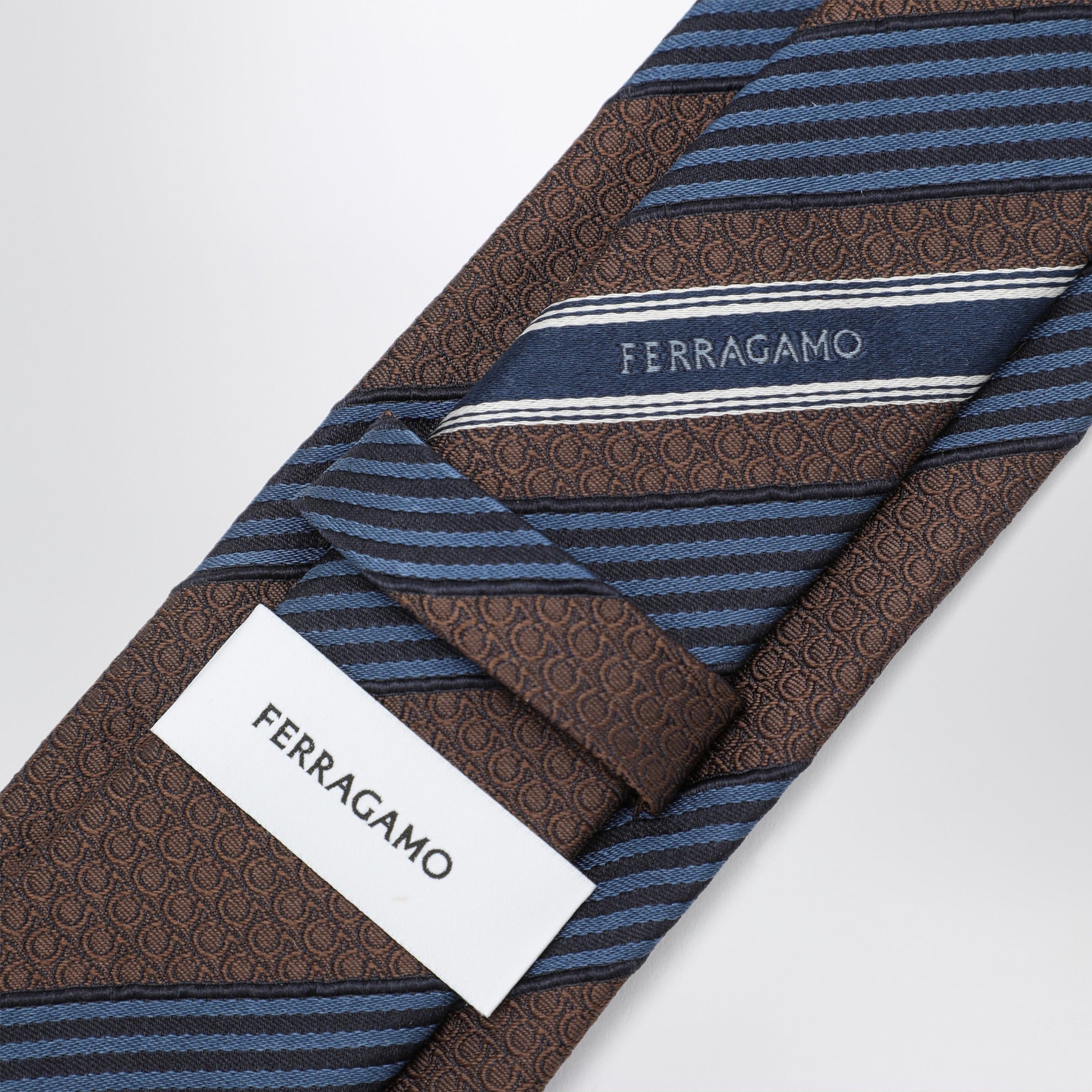 Silk tie with Gancini print and diagonal stripes