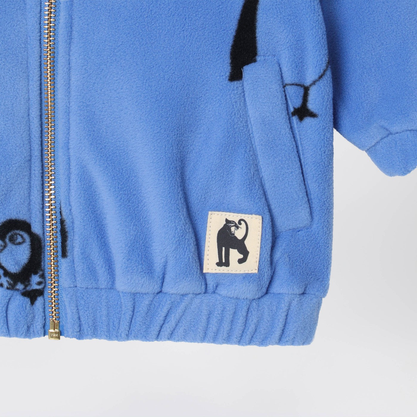 Blue zip-up sweatshirt with penguins