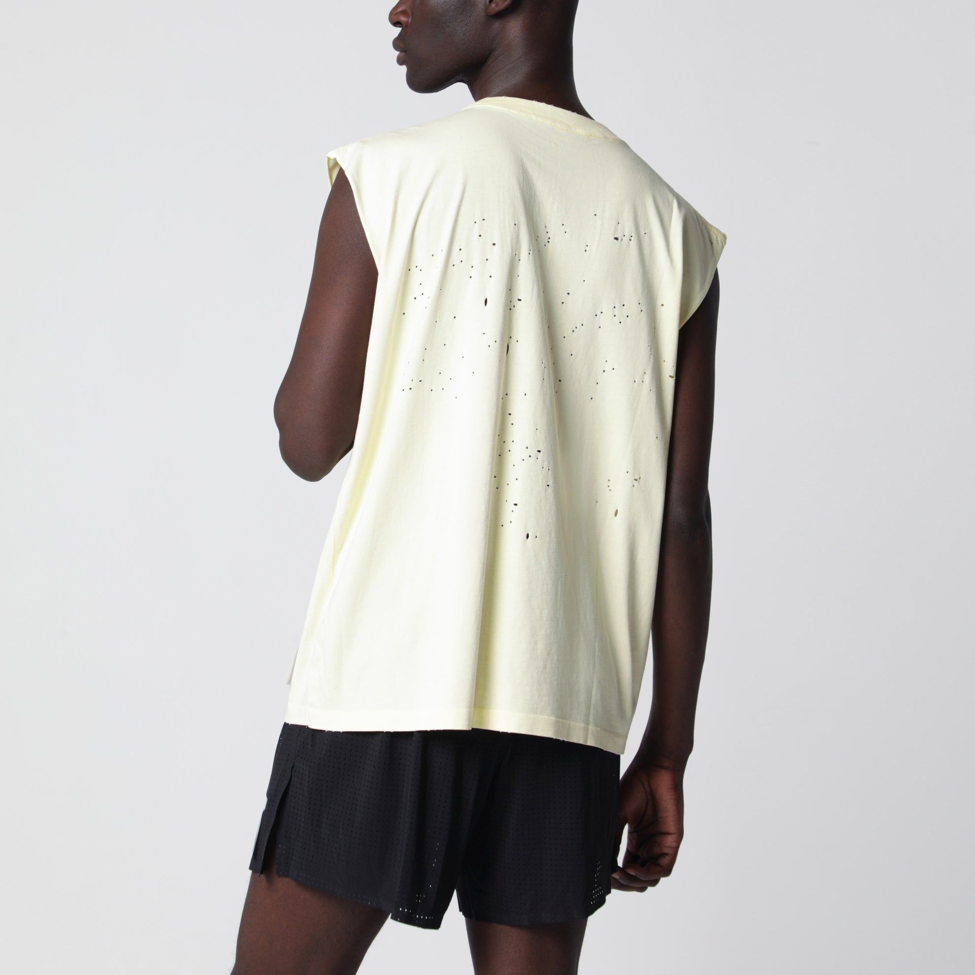 Light yellow MothTech tank top with perforations