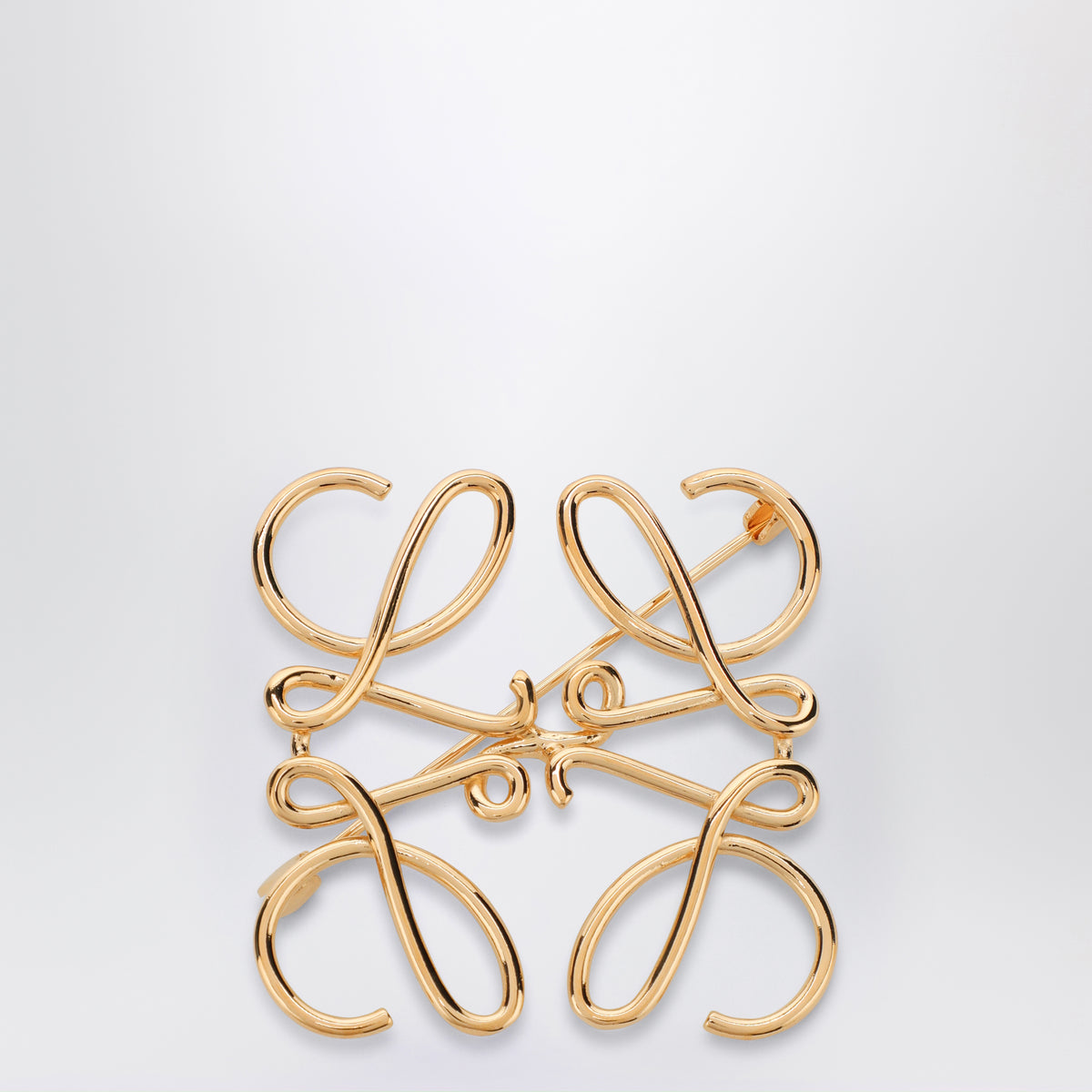 Broche Anagram en métal doré
