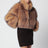 Kurze Jacke aus beigem Kunstpelz