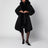 Manteau noir ceinturé avec finitions en fausse fourrure