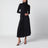 Black asymmetrical dress with high neck