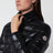 Piumino nero in nylon laqué