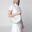 Borsa a spalla Prada Arqué medium in pelle bianca