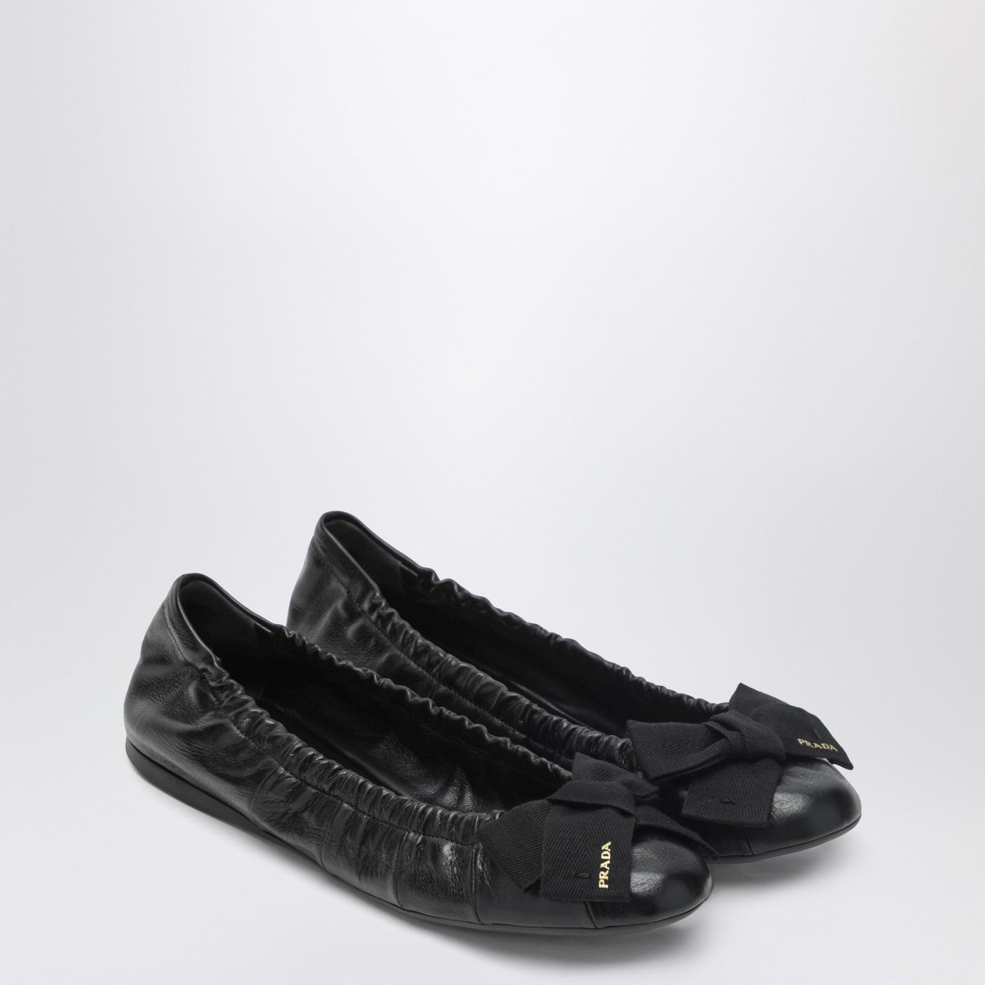 Black patent leather ballet flats with bow