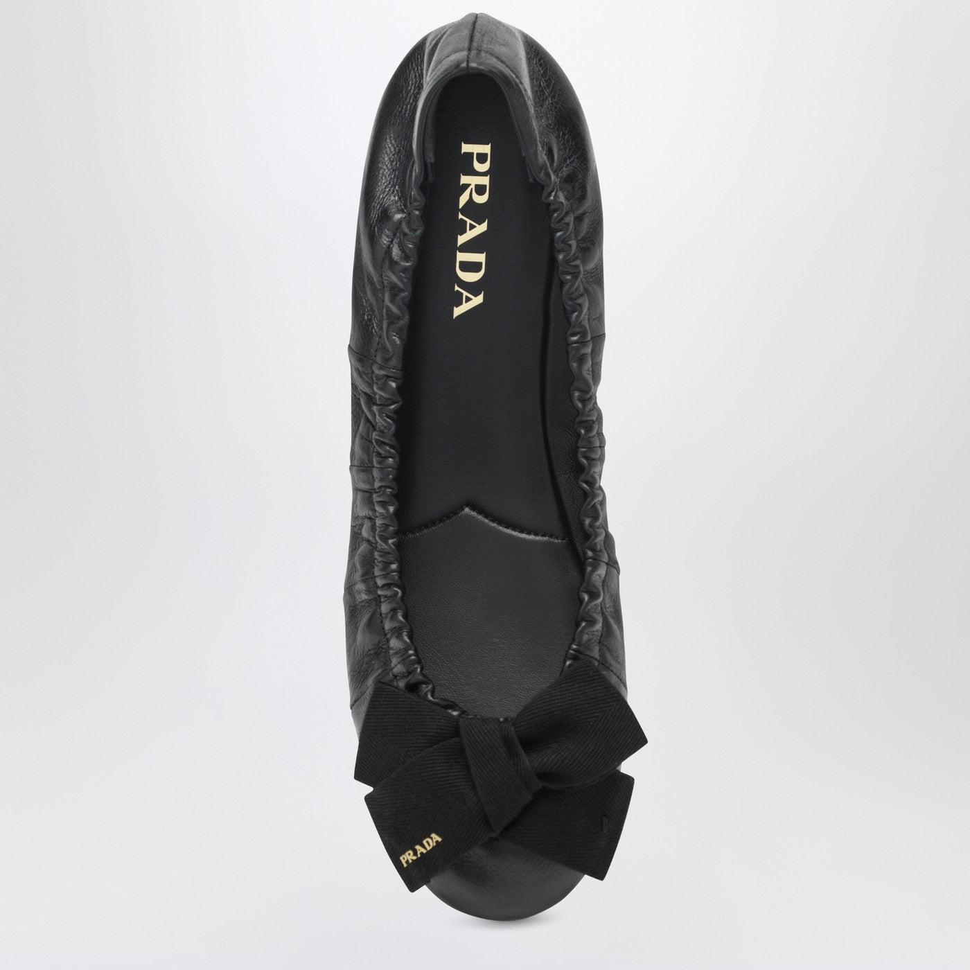 Black patent leather ballet flats with bow
