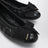 Black patent leather ballet flats with bow