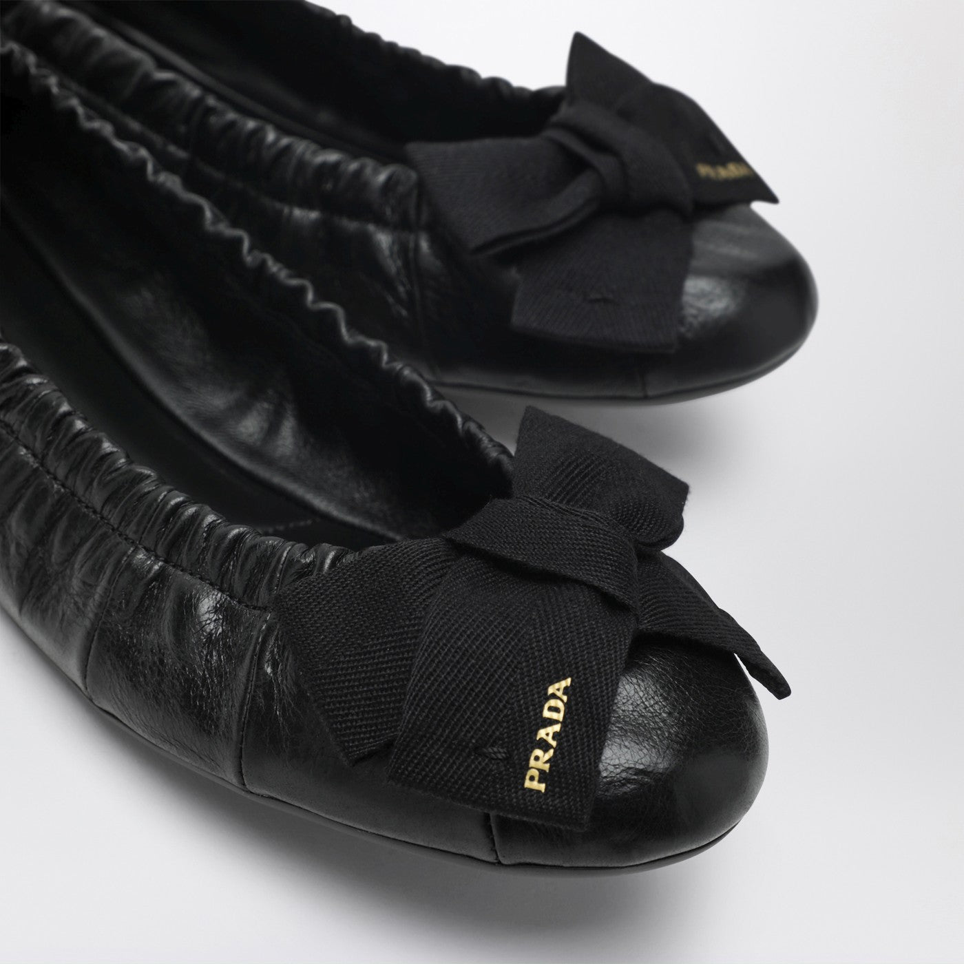 Black patent leather ballet flats with bow