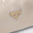 Cameo-colored satin pouch