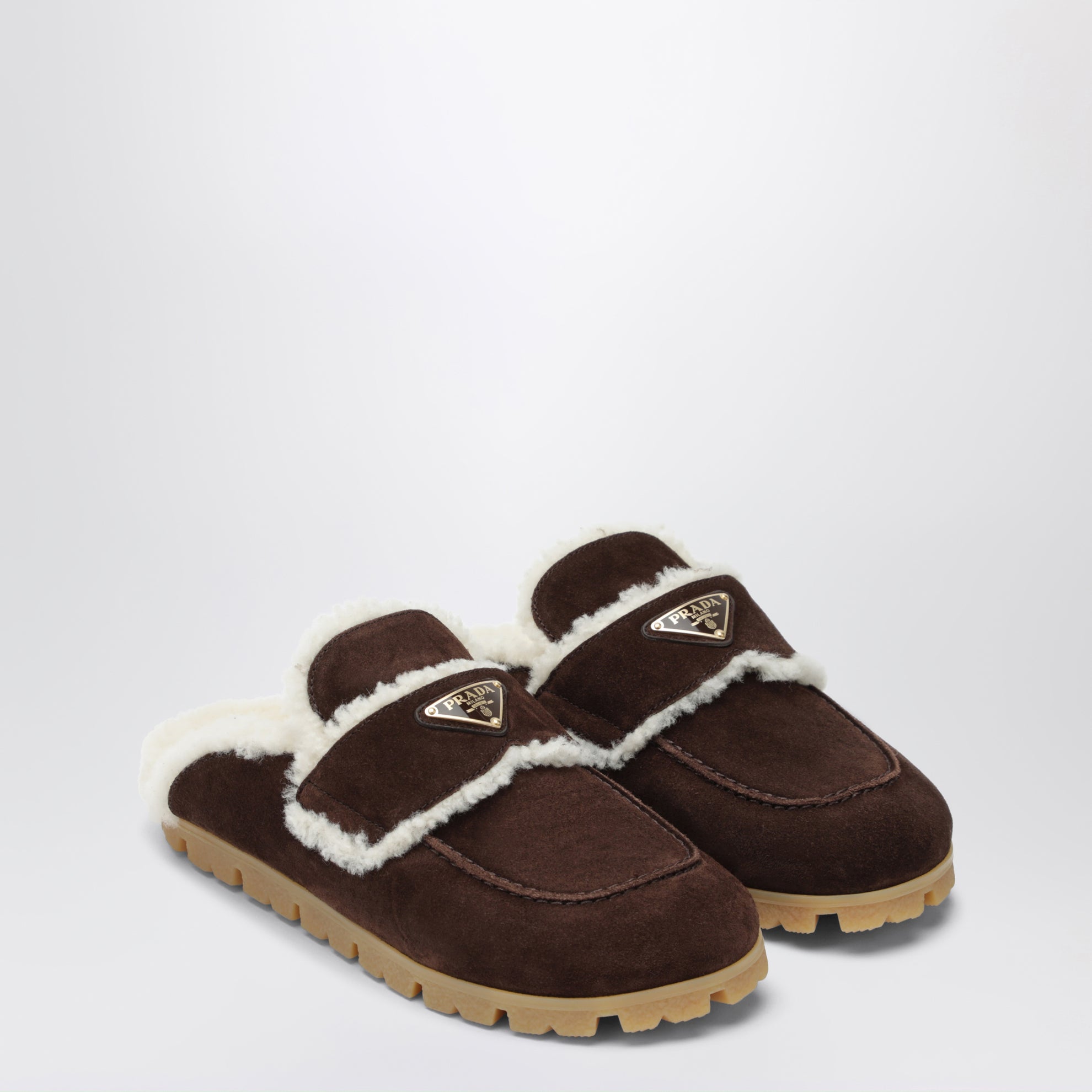 Brown suede and shearling clogs