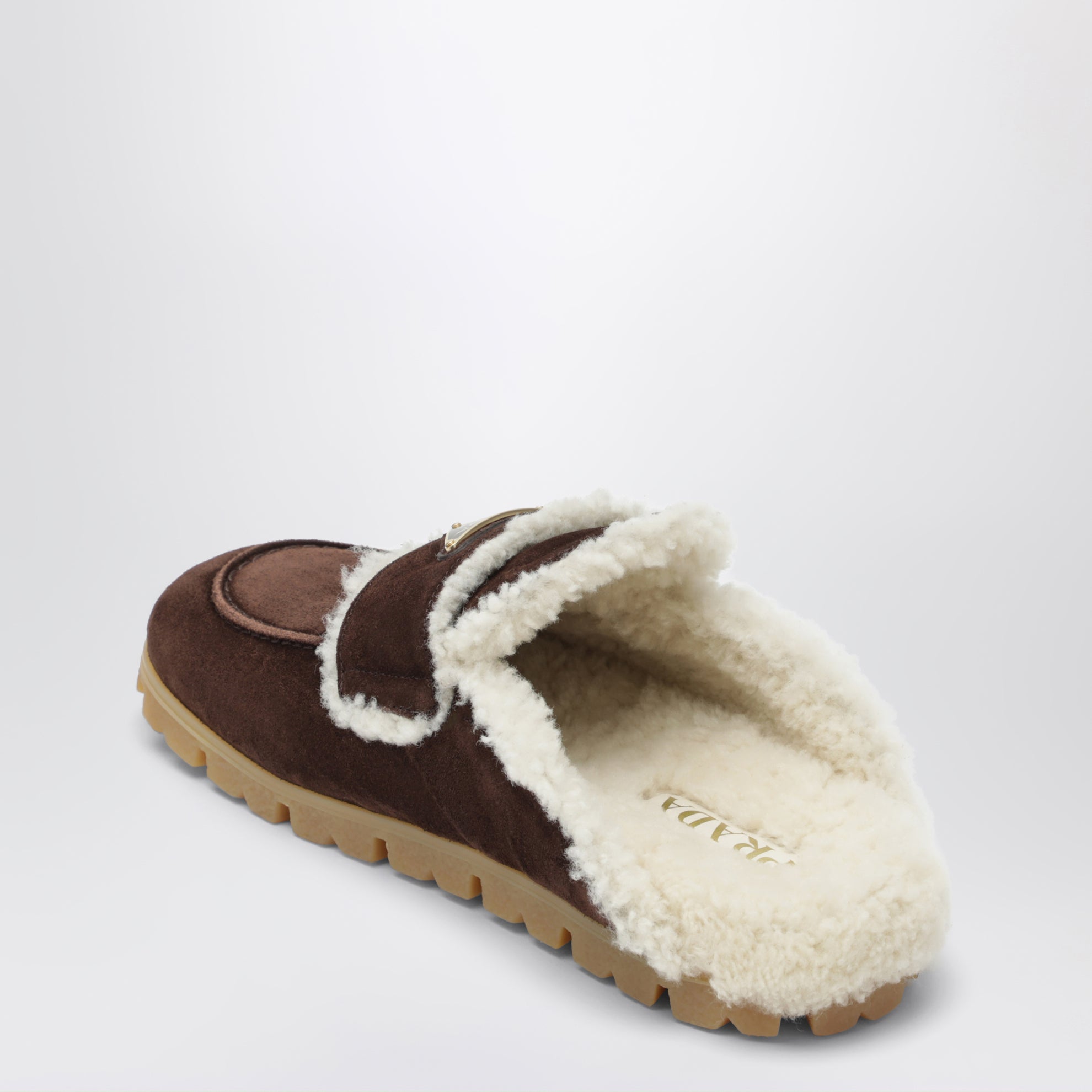 Brown suede and shearling clogs