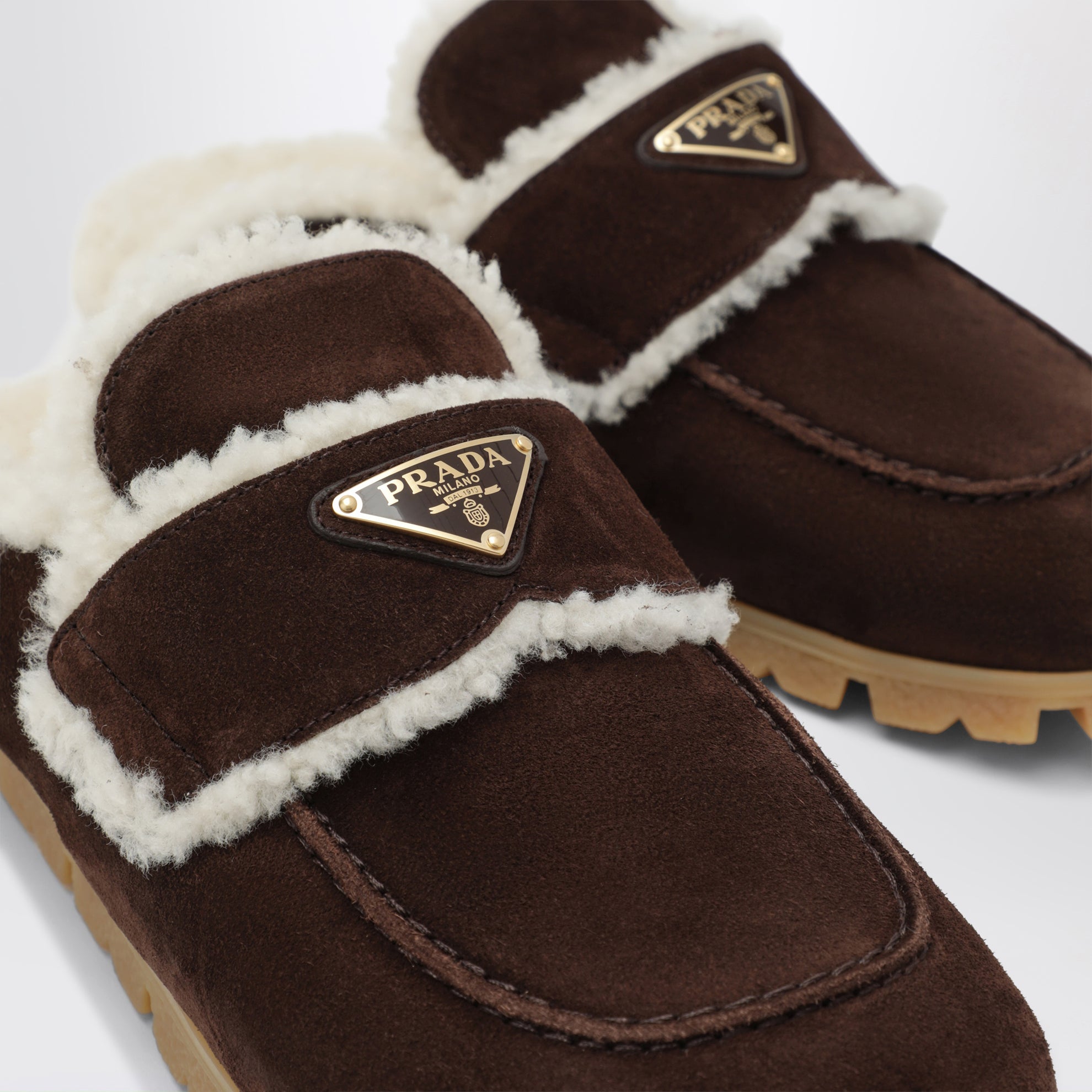 Brown suede and shearling clogs