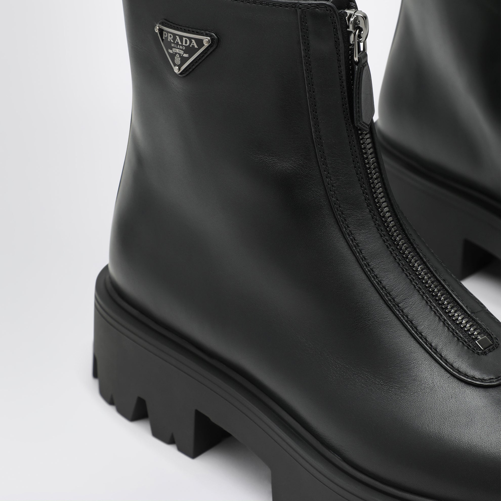 Black leather zip-up ankle boots
