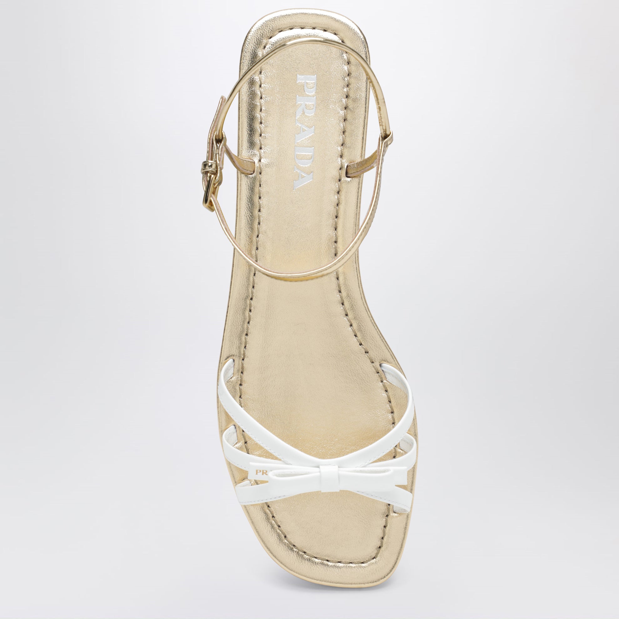 White and gold leather sandals with bow