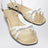 White and gold leather sandals with bow
