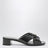 Black leather mules with triangular logo