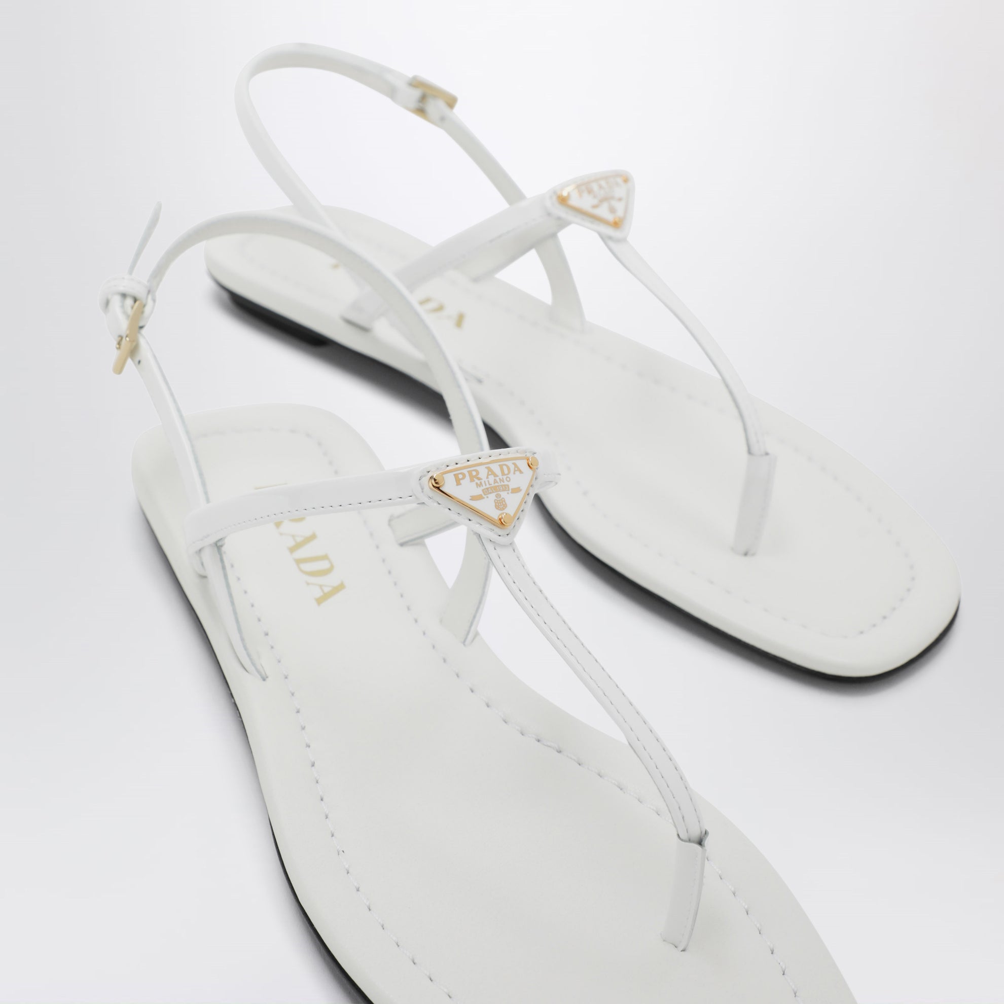 White patent leather thong sandals