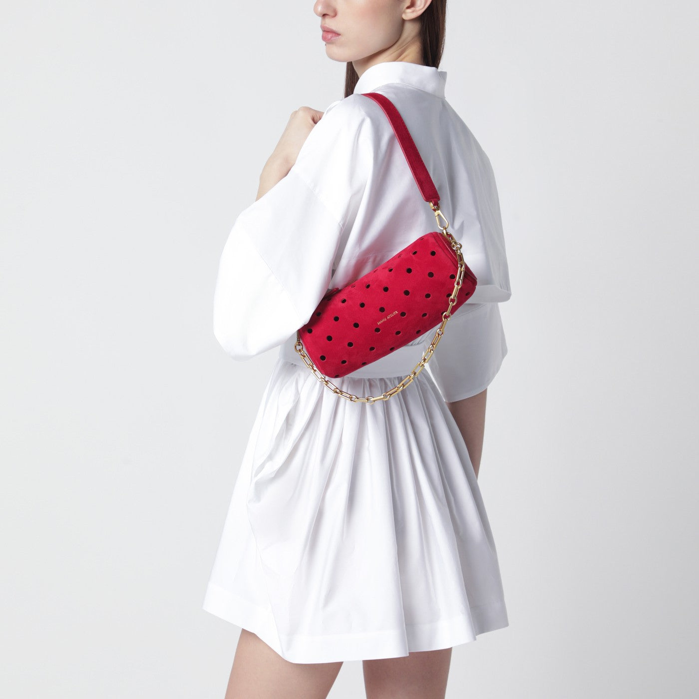 Mini Cylinder bag in perforated red suede