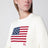 Maglione color crema con bandiera
