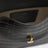 Brown T-lock clutch in crocodile-embossed leather