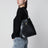 Schwarze Bucket Bag aus Leder mit Riemen