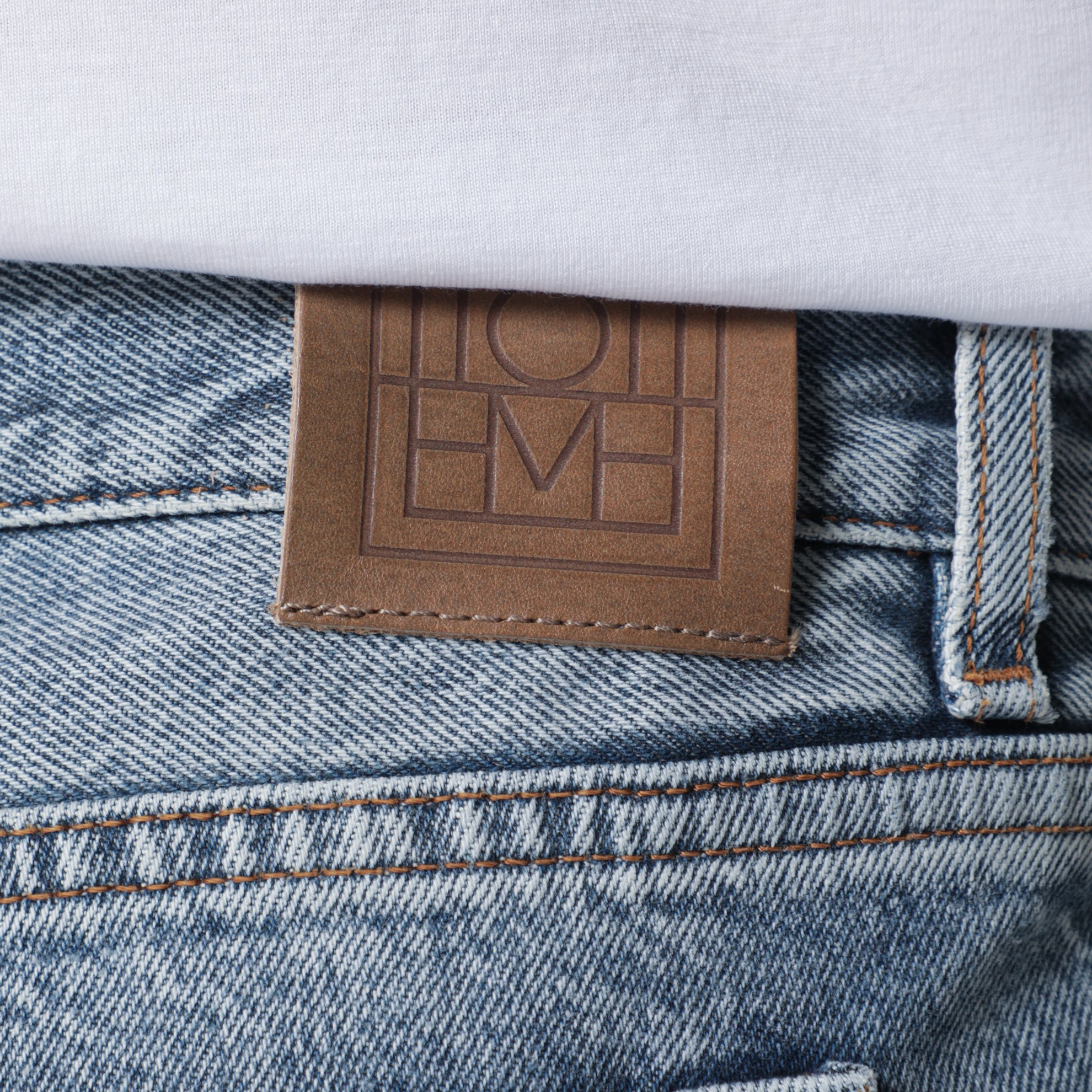 Jeans effetto slavato in denim organico