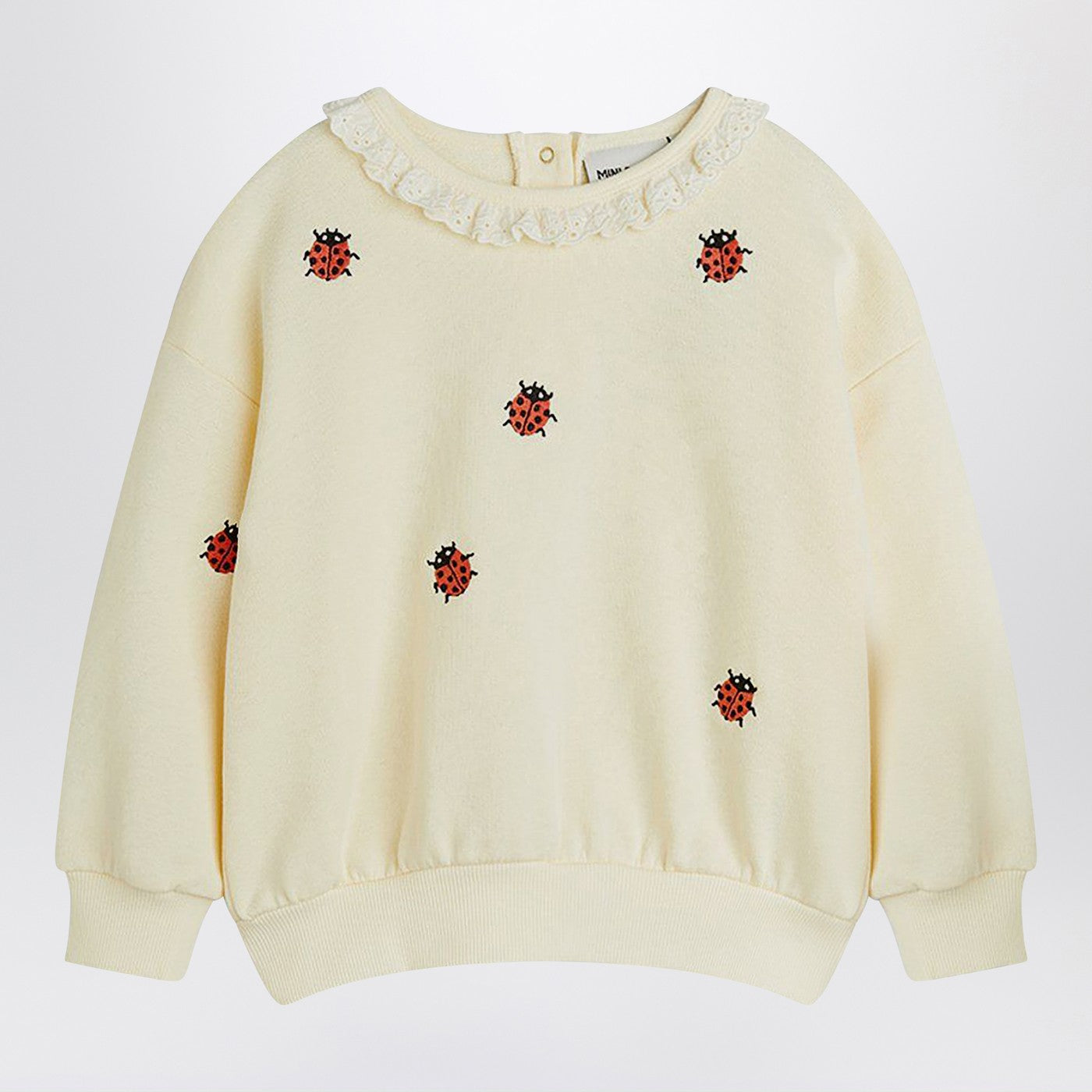 Sweat crème avec des coccinelles brodées