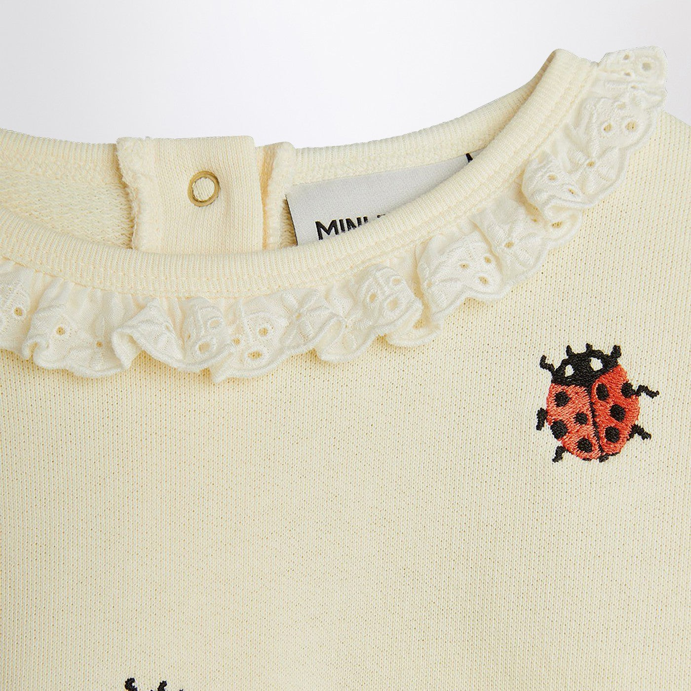 Sweat crème avec des coccinelles brodées