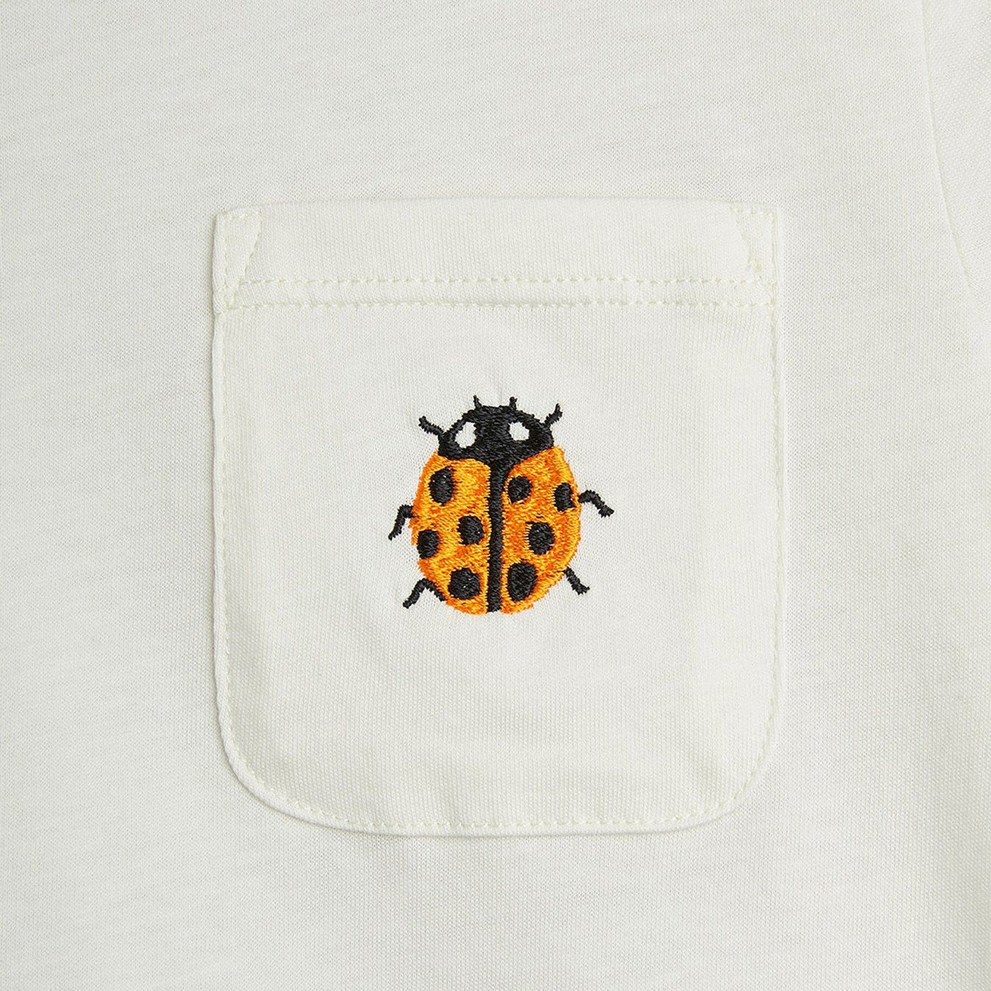 T-shirt blanc avec broderie coccinelle