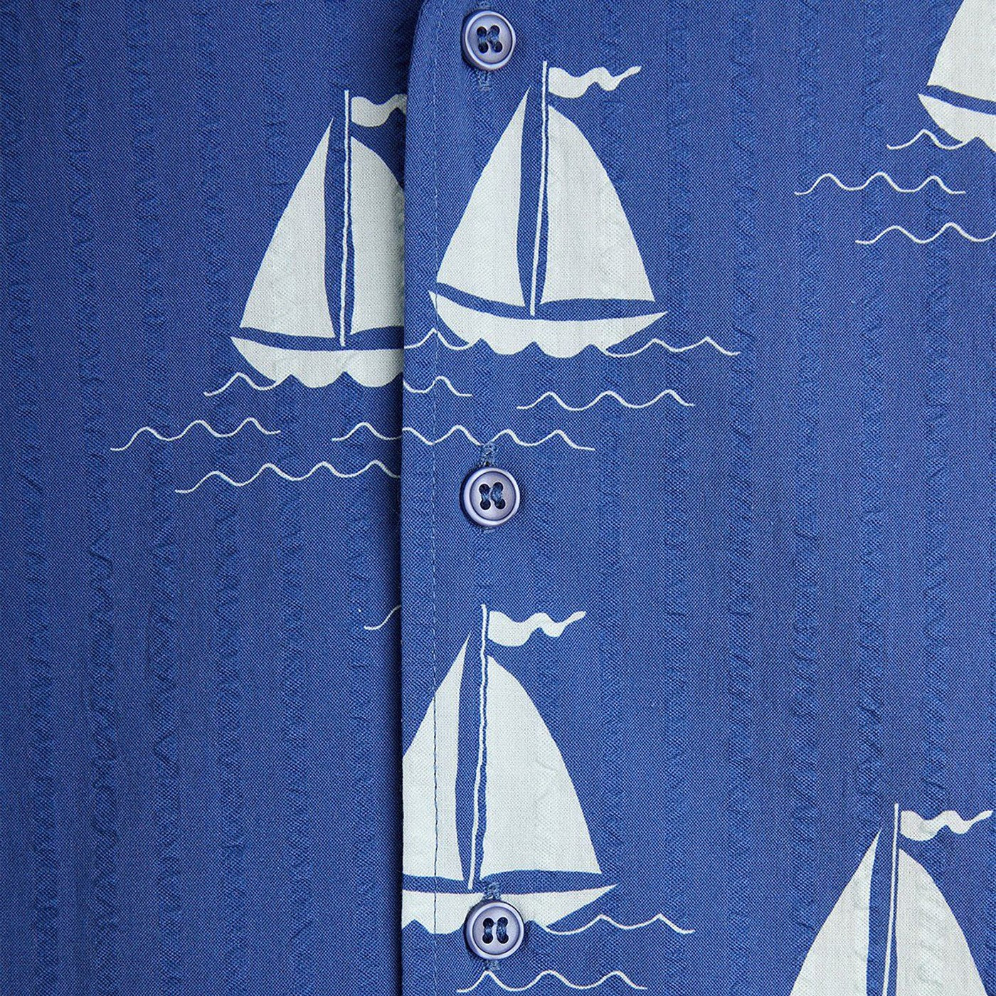Blue shirt with sailboats