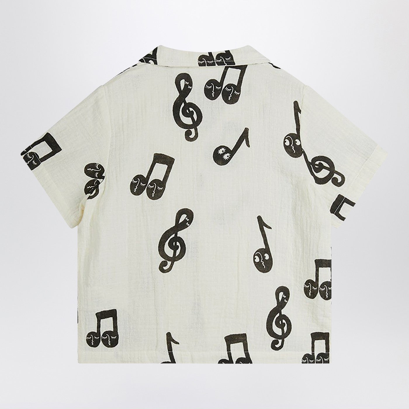 Chemise blanche avec des notes de musique