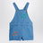 Salopette azzurra in denim con note musicali