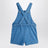 Salopette azzurra in denim con note musicali