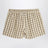 Shorts beige à motif à carreaux