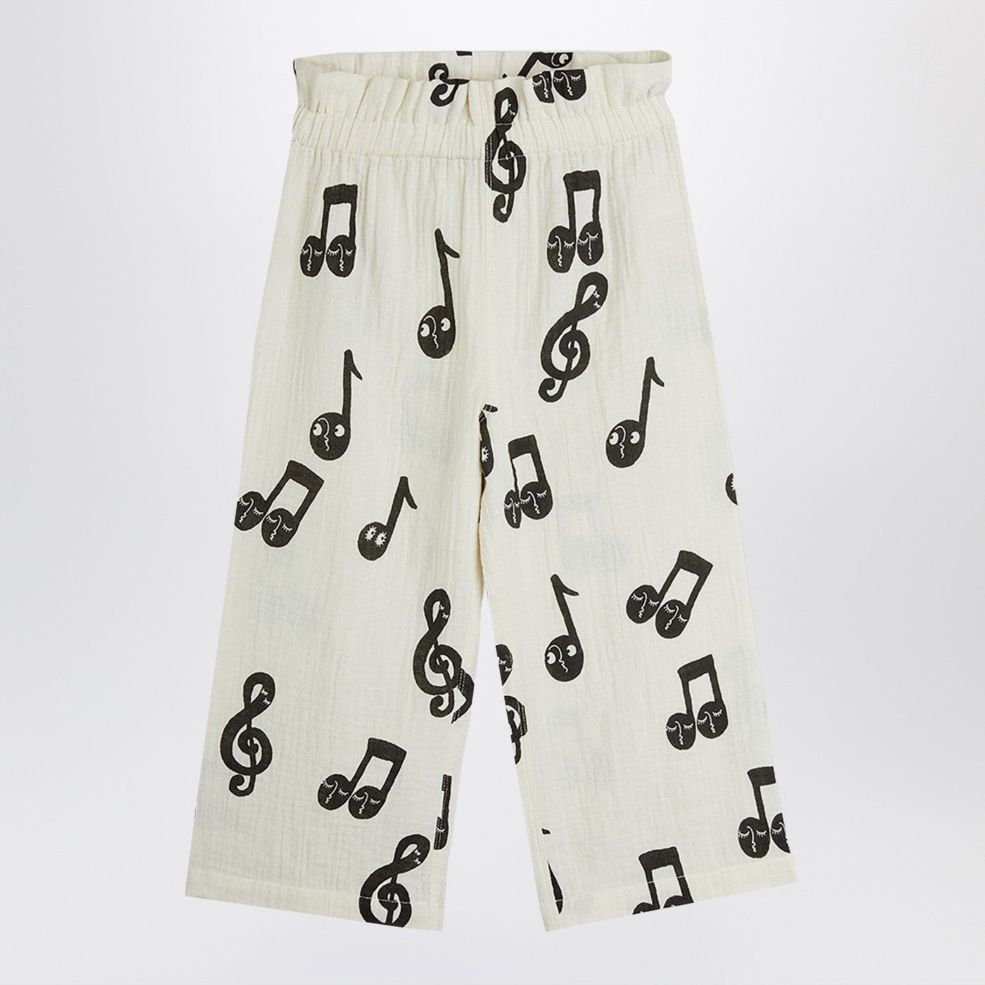 Wide white trousers with musical notes