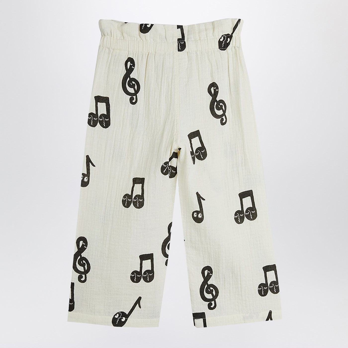 Wide white trousers with musical notes