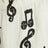 Wide white trousers with musical notes